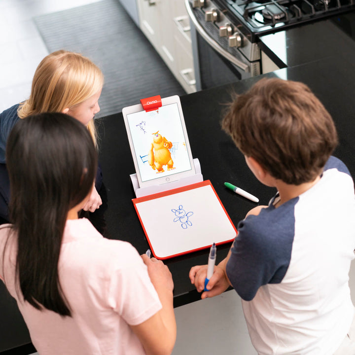Two children drawing together on the Creative Board at a kitchen counter