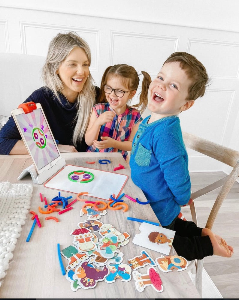 A little one playing with the Little Genius Starter Kit at home