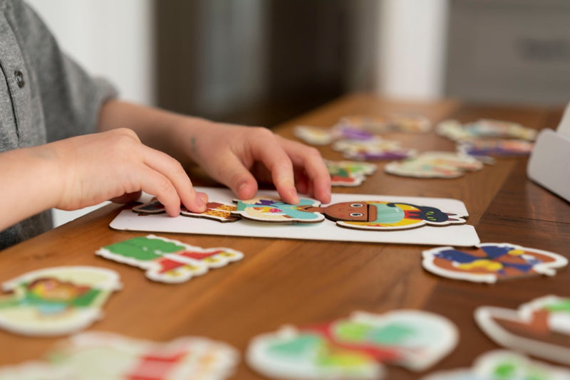 A little one playing with the Little Genius Starter Kit at home