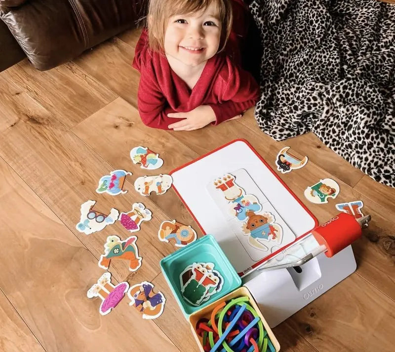 A little one playing with the Little Genius Starter Kit at home