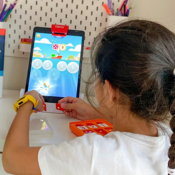 A girl playing Osmo Numbers