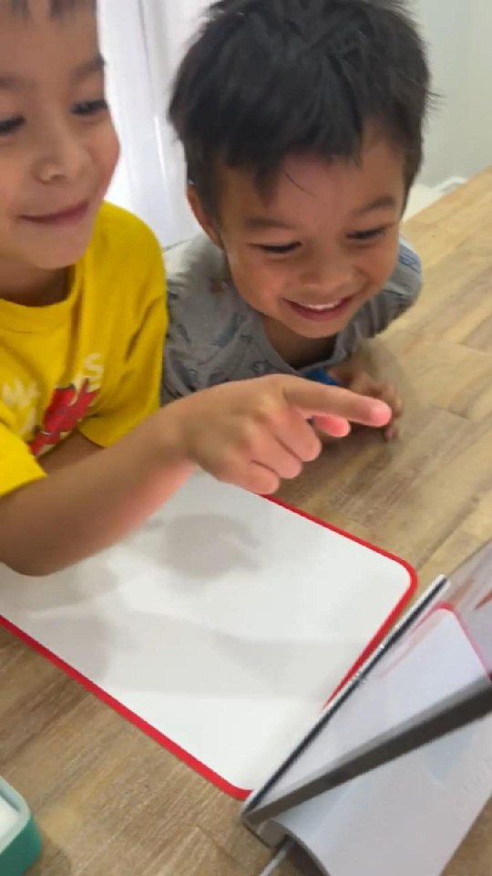 Two little ones playing Little Genius Sticks & Rings for the first time