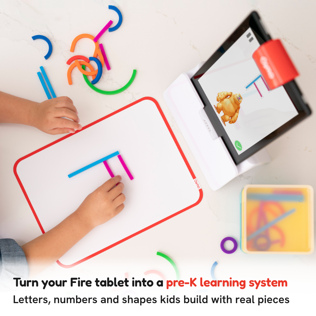 A child building a letter with silicone Sticks and Rings on the play mat while a Fire tablet on the Osmo base reacts