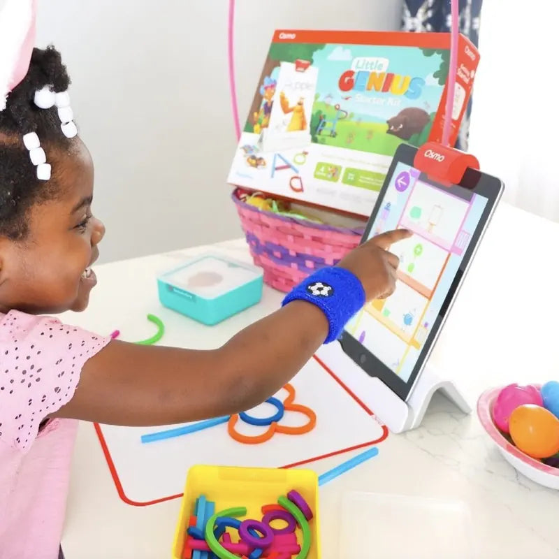 A little one playing with the Little Genius Starter Kit at home
