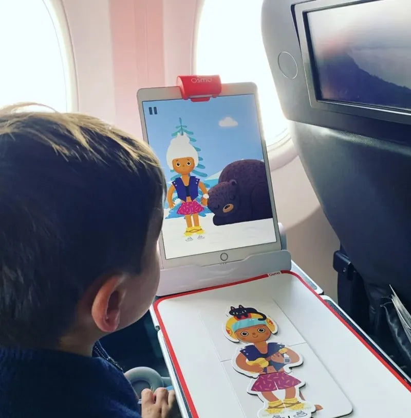 A little one playing with the Little Genius Starter Kit at home