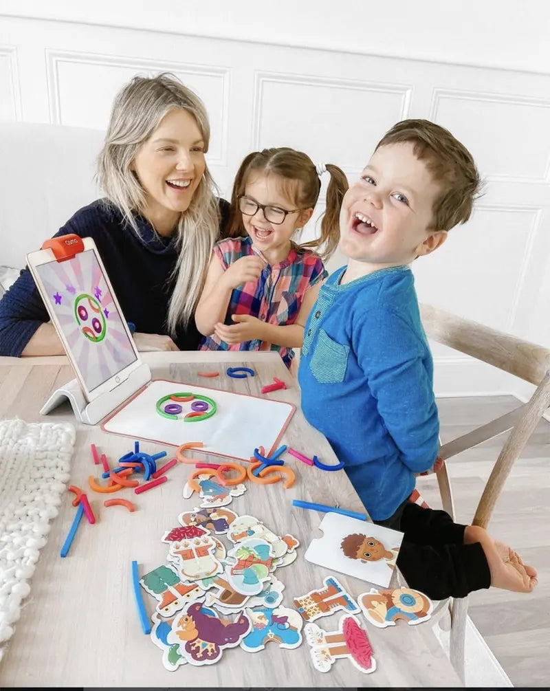 A little one playing with the Little Genius Starter Kit at home
