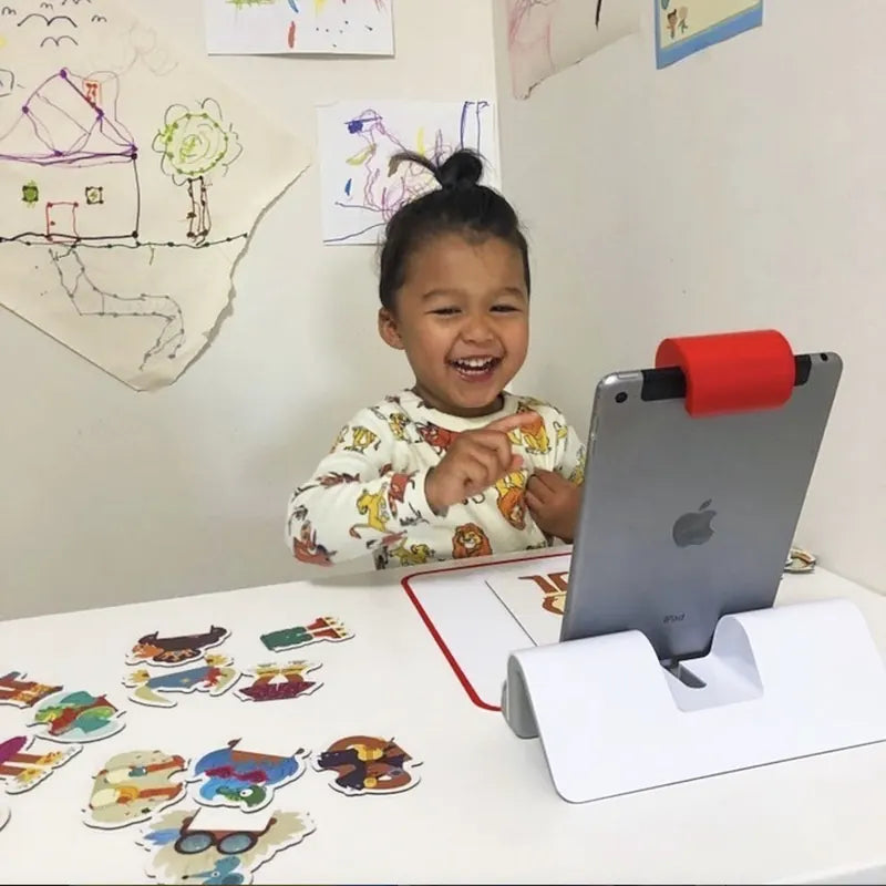 A little one playing with the Little Genius Starter Kit at home