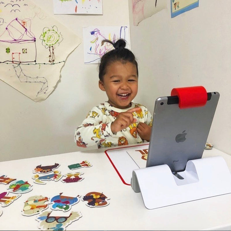 A little one playing with the Little Genius Starter Kit at home
