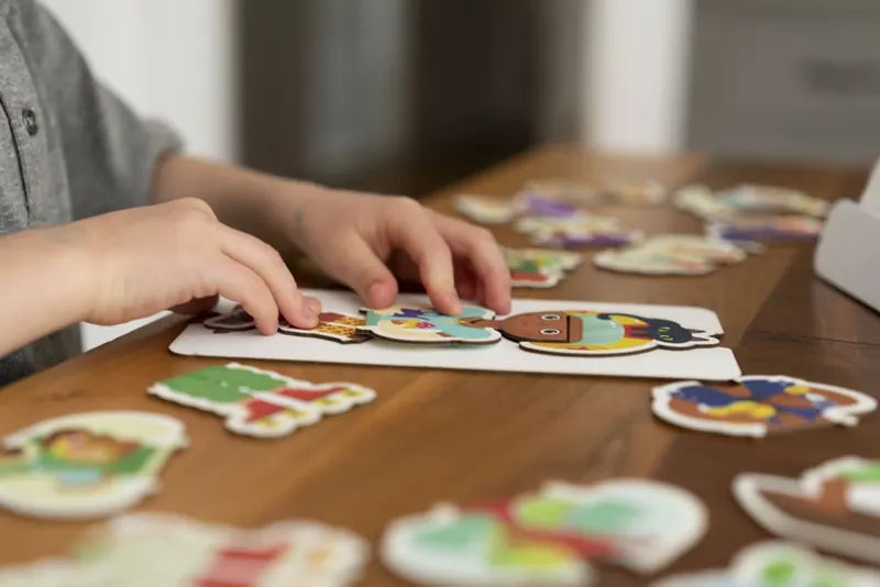 A little one playing with the Little Genius Starter Kit at home