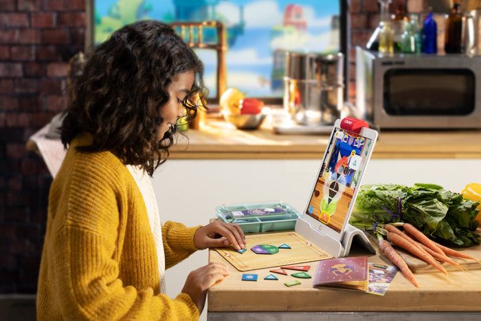 Girl playing Math Wizard at the kitchen table